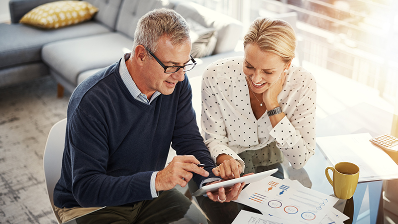 Mature couple reviewing finances together