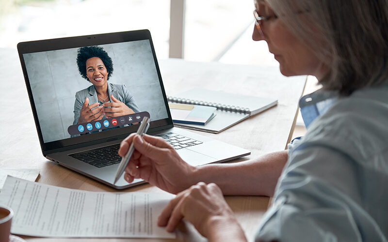 Woman having virtual meeting with financial advisor