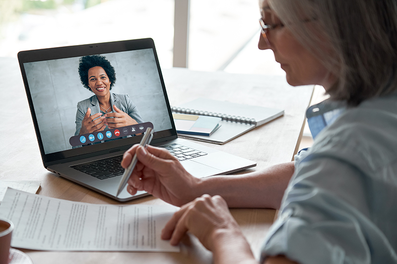 Woman having virtual meeting with financial advisor