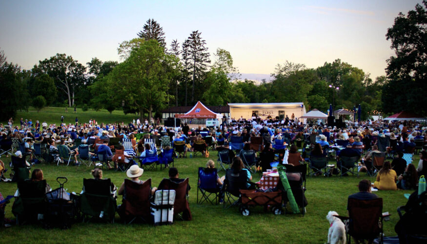 View of Picnic in the Park at Petrifying Springs of crowd watching the entertainment