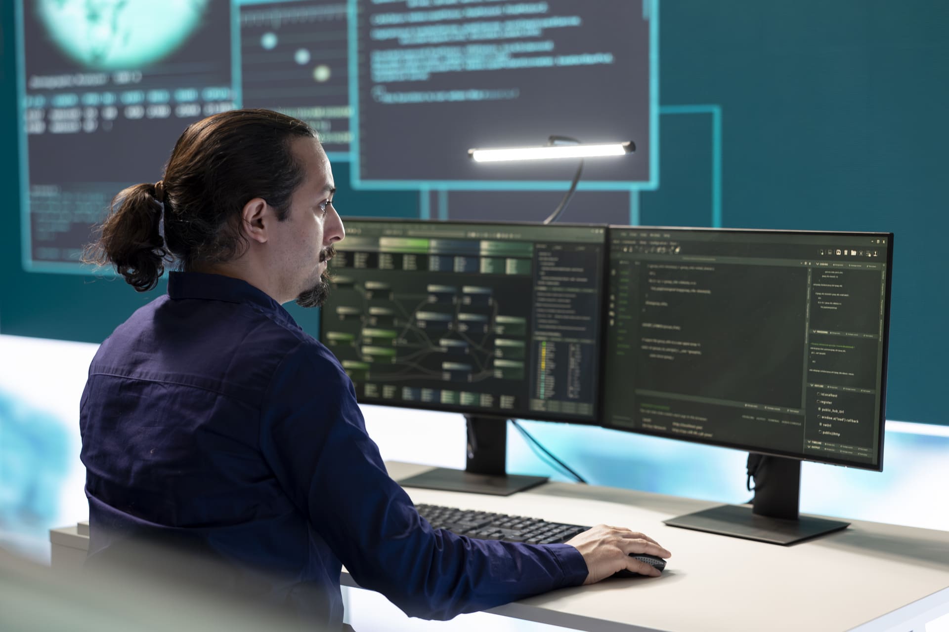 Man at the computer - The Future of Cybersecurity: What Businesses Need to Know