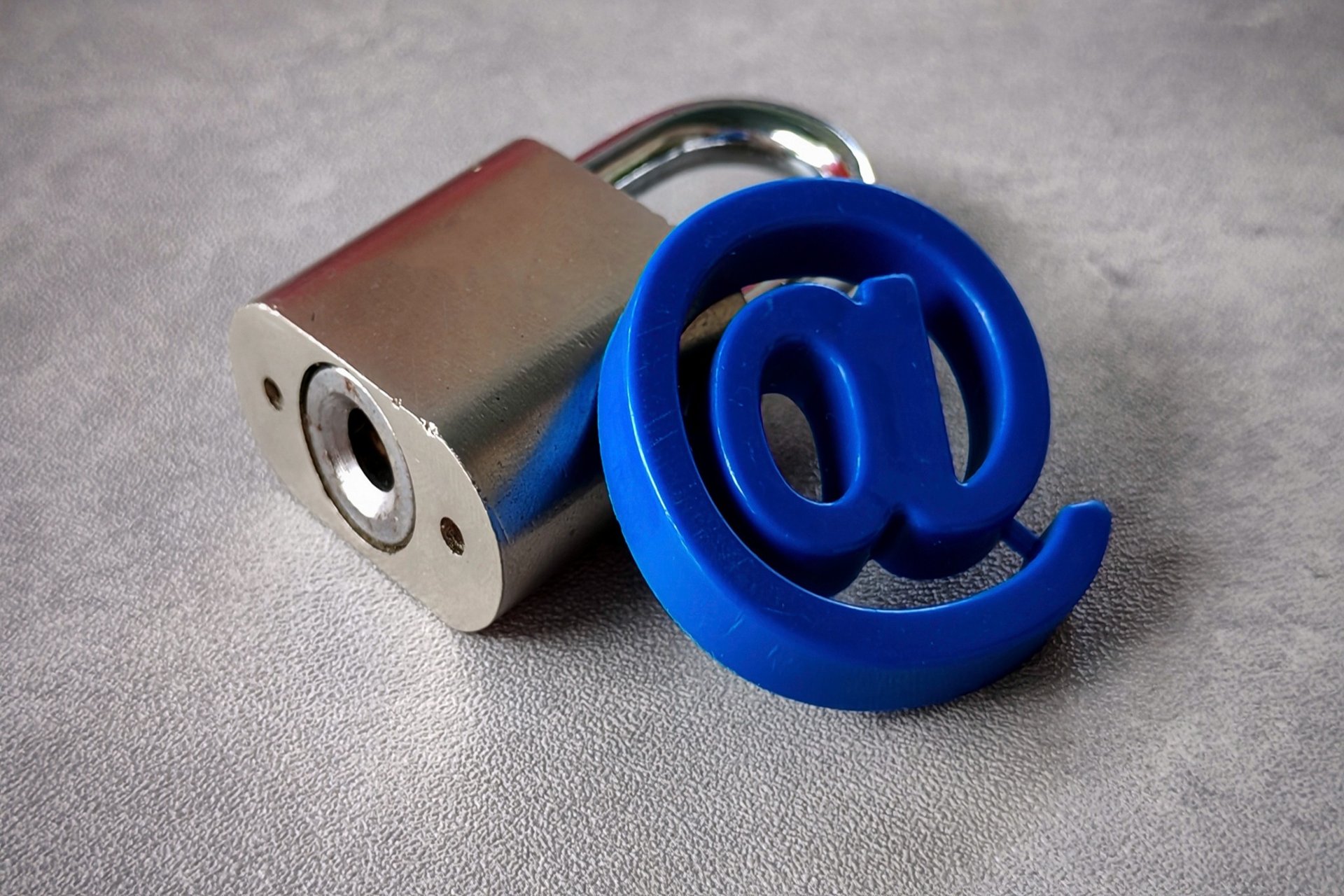 at-symbol-and-padlock-email-security-concept - What is Spoofing in Cyber Security? Definition & Examples