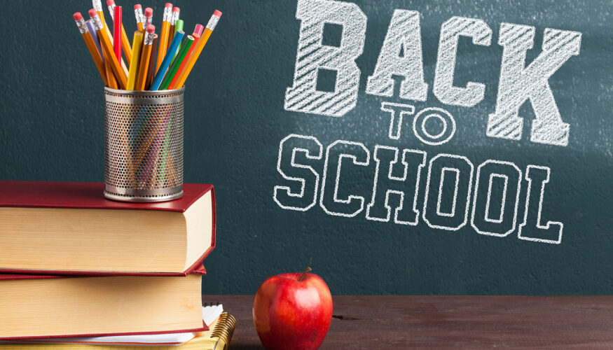 Back to School on chalkboard with stack of books