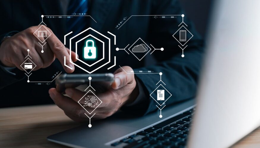 Businessman using smartphone with cybersecurity icons overlay - CMIT Smishing