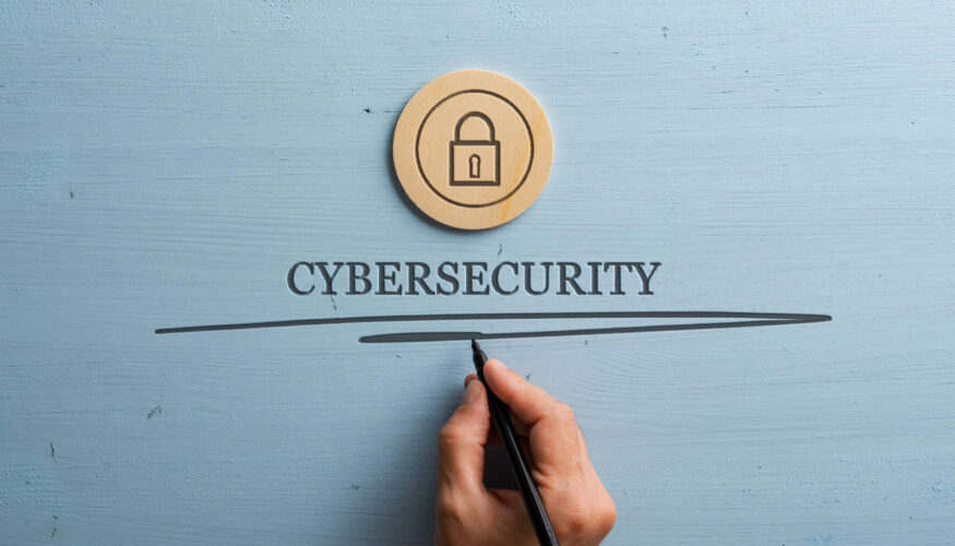 Cyber Security Business guide - Hand-writing-the-word-cybersecurity-with-a-padlock-icon-above-it