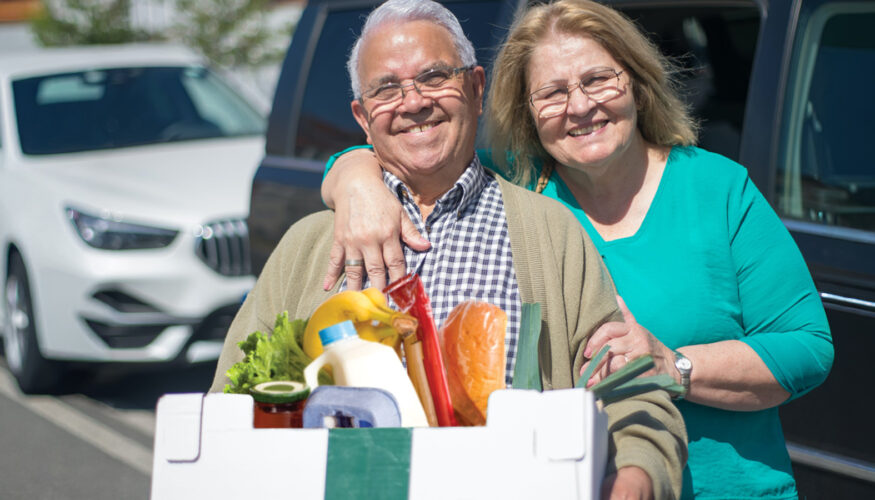 Couple picking up Food Pantry prepared food box - Shalom Center