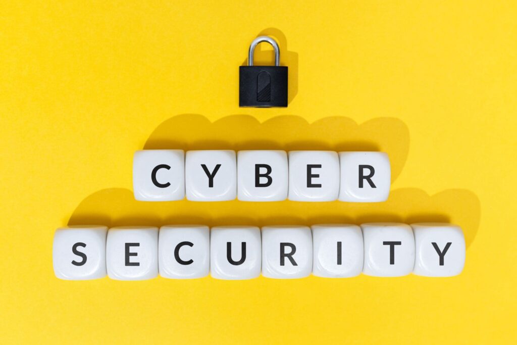 CMIT White-blocks-spelling Cyber Security with-a-padlock-on-yellow-background