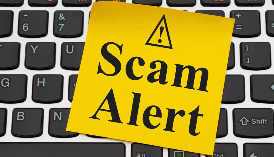 Kenosha County Email Scam Alert - Scam Alert Post It on keyboard