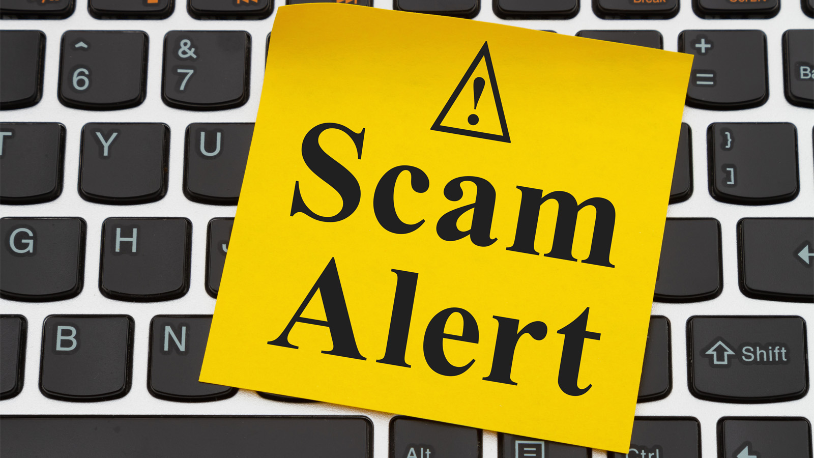 Kenosha County Email Scam Alert - Scam Alert Post It on keyboard
