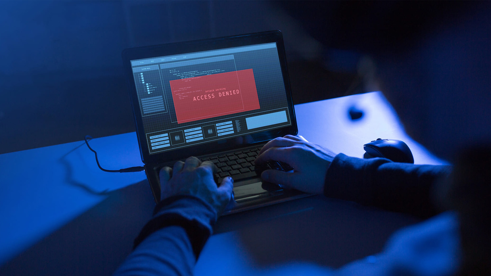 CMIT Brute Force Attacks - Hacker-attempting-access-with-red-access-denied-warning-on-screen