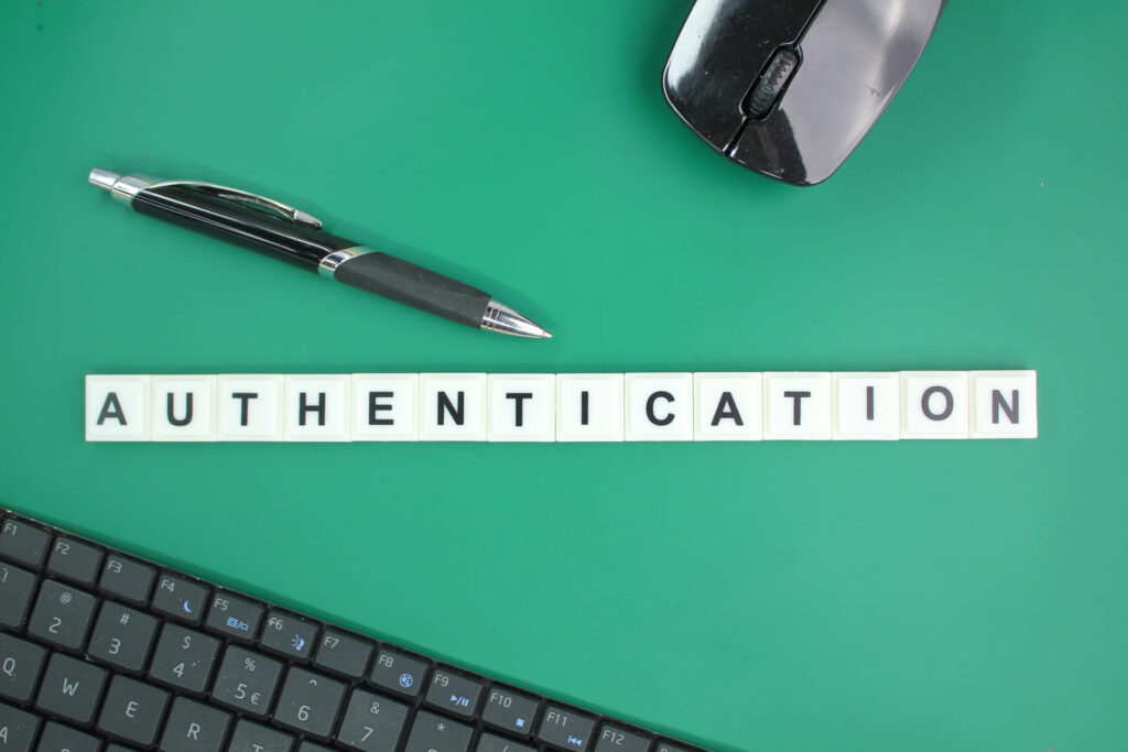 Multi-Factor Authentication - Word-authentication-spelled-with-letter-tiles-beside-keyboard-and-mouse