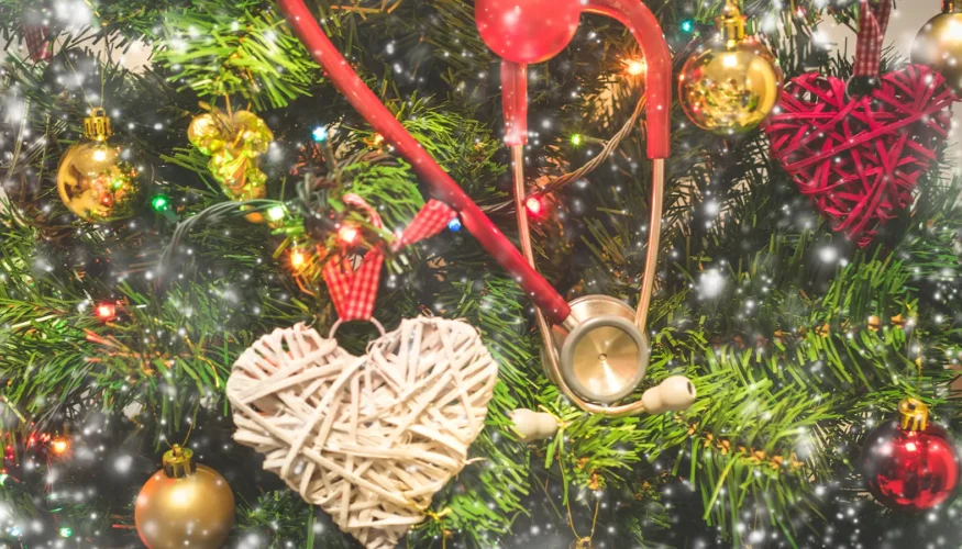 Heart attack deaths spike during the winter holidays - Christmas tree with hearts and stethoscope