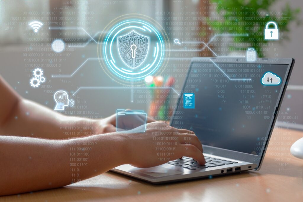 Hands-typing-on-laptop-with-cybersecurity-icons-overlay - 15-point checklist to prepare for a cyber attack