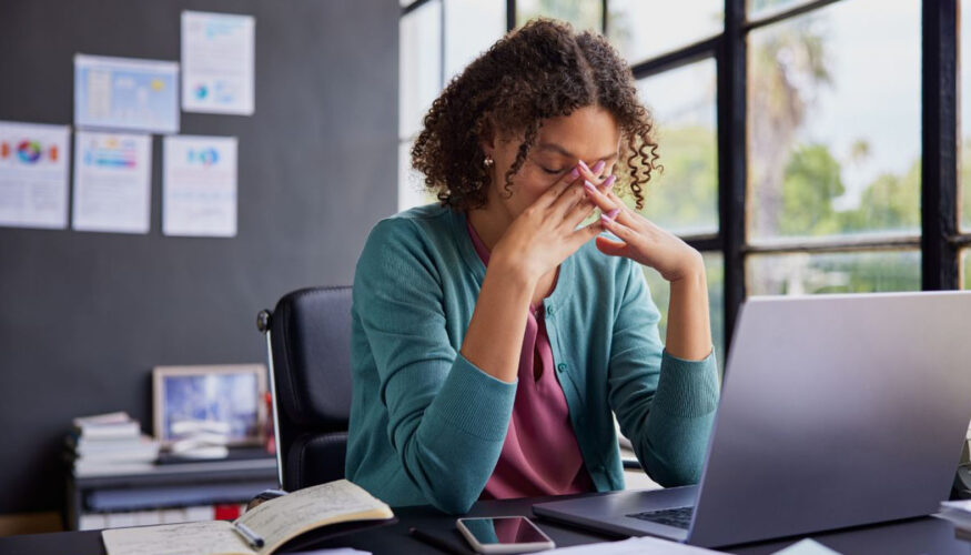Woman sitting in front of laptop - Emerging Cybersecurity Threats Are Hiding in Plain Sight