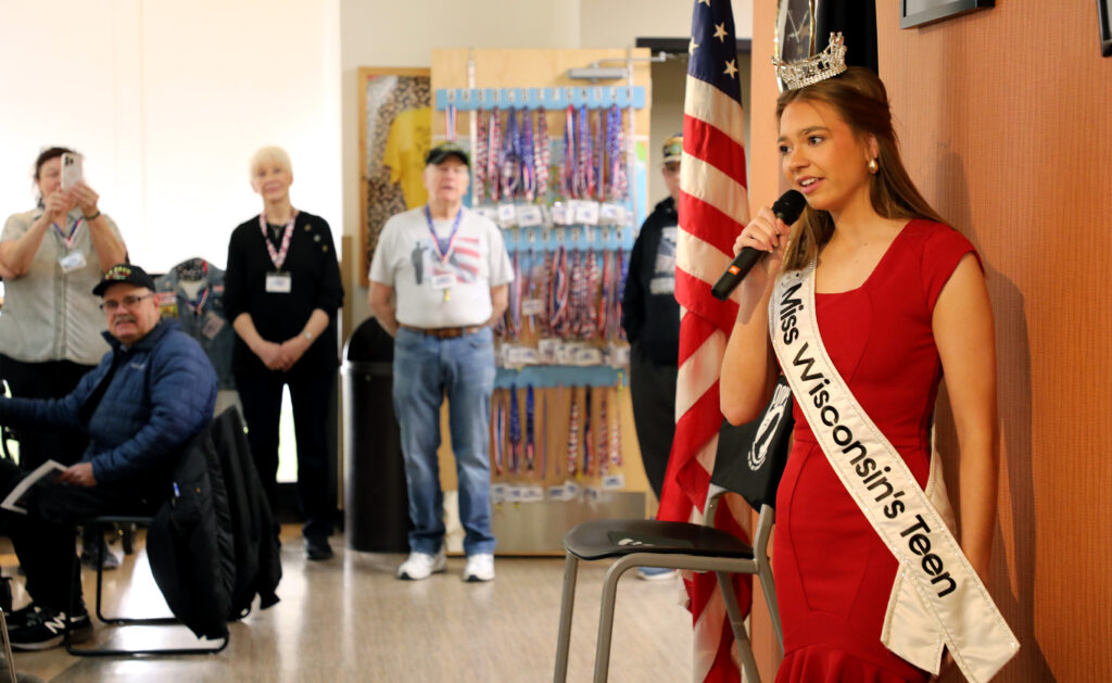 Miss Wisconsin's Teen 2025 Natalie Popp speaks on her platform of serving veterans and telling their stories during a recent visit to the American Heroes Cafe at Festival Foods in Kenosha.