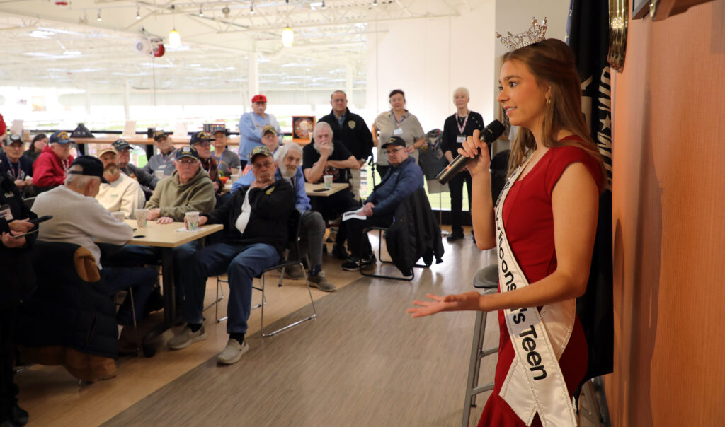 Miss Wisconsin's Teen 2025 Natalie Popp speaks on her platform of serving veterans and telling their stories during a recent visit to the American Heroes Cafe at Festival Foods in Kenosha.
