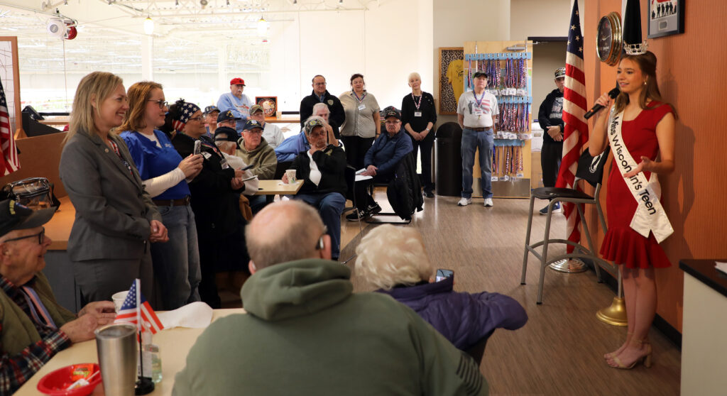 Miss Wisconsin's Teen 2025 Natalie Popp speaks on her platform of serving veterans and telling their stories during a recent visit to the American Heroes Cafe at Festival Foods in Kenosha.