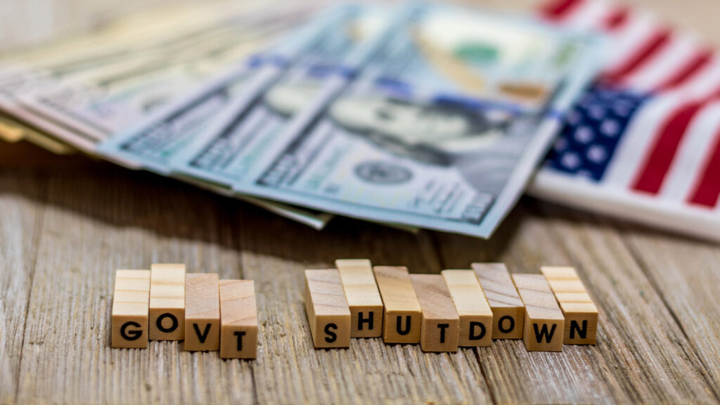 CSB Offering Relief Loan to Government Employees During Shutdown - money flag and government shutdown blocks