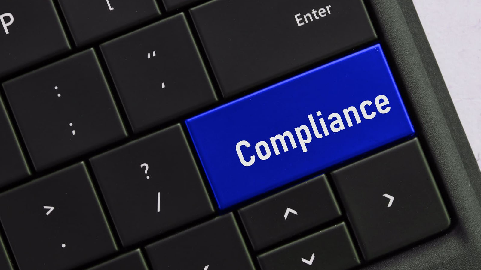 computer-keyboard-with-a-compliance-button-concept - IT Compliance Requirements