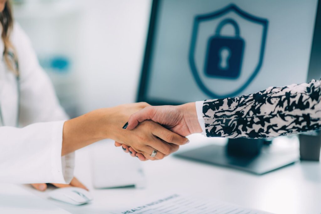 Handshake-after-signing-medical-data-form What Is Data Compliance? Data Security 101