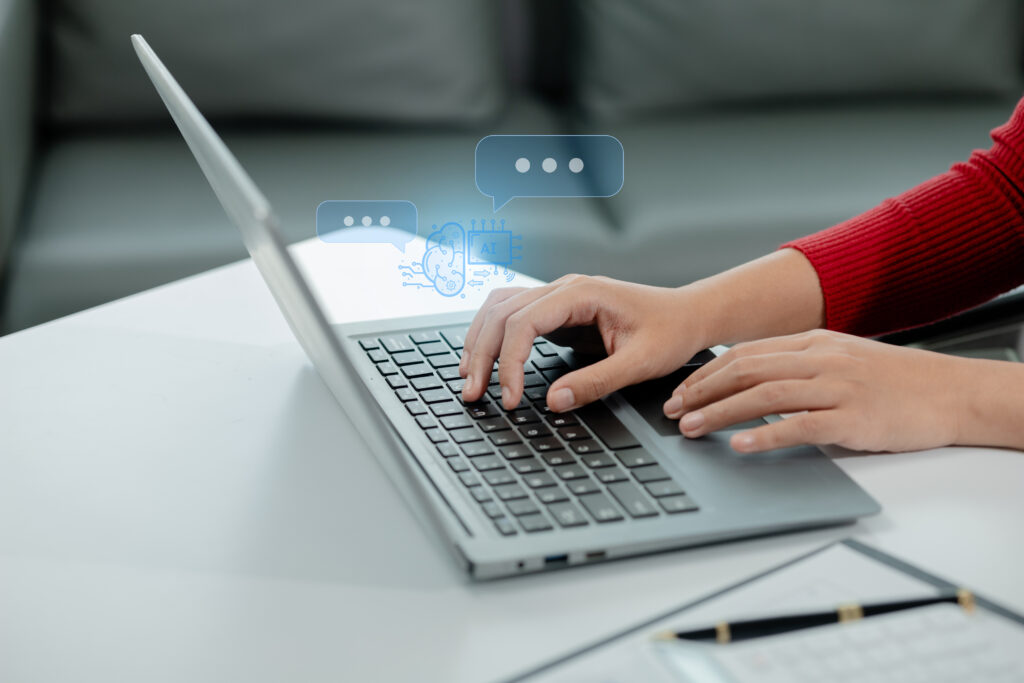 A laptop user using AI chat