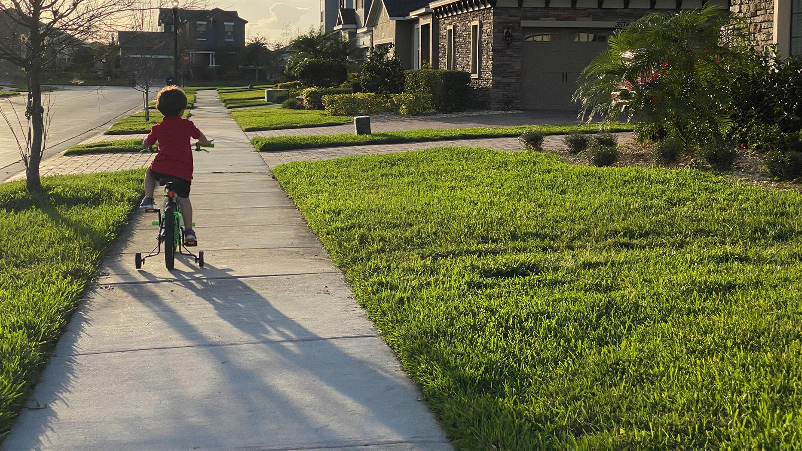 City Parking Regulations Child on bicycle on sidewalk